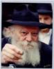 The Rebbe distributes coins to be given to charity